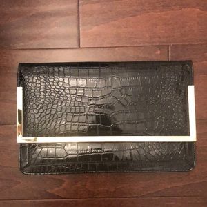 Women’s black clutch handbag